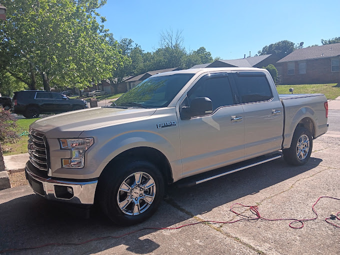 A gleaming silver Ford F-150 after a full mobile detail