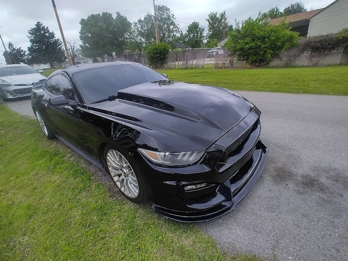 Glossy black Ford Mustang after a professional exterior detail
